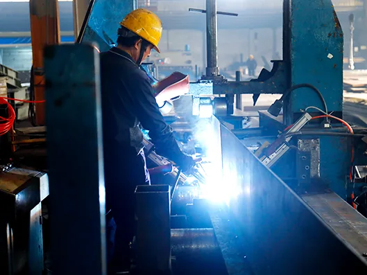 Welding a built-up H beam for a steel structure building